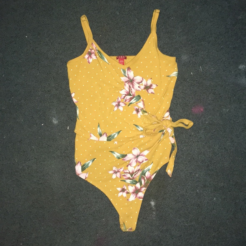 This is a bodysuit from the store Guess!